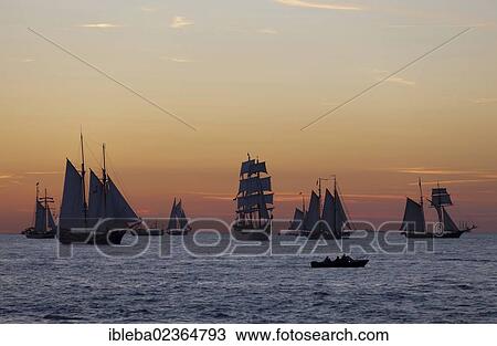 "Sailing ships against an atmospheric evening sky, Hanse Sail 2012, Warnemuende, Mecklenburg-Western Pomerania, Germany, Europe" View Large Photo Image Stock Image - "Sailing ships against an atmospheric evening sky, Hanse Sail 2012, Warnemuende, Mecklenburg-Western Pomerania, Germany, Europe". Fotosearch