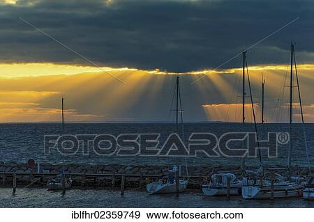 Stock Photo - "Sailing yachts at dusk in the harbour of Timmendorf, Poel Island, Mecklenburg-Western Pomerania, Germany, Europe". Fotosearch