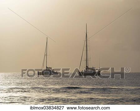 Stock Photo - "Sailing yachts at twilight near Rodney Bay, Saint Lucia, Lesser Antilles, Windward Islands, North America". Fotosearch
