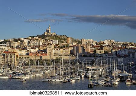 "Sailing yachts, old port and Notre Dame de la Garde, landmark of the city, historic center, Marseille, Departement Bouches-du-Rhone, Region Provence-Alpes-Cote d’Azur d’Azur, France, Europe" View Large Photo Image Stock Image - "Sailing yachts, old port and Notre Dame de la Garde, landmark of the city, historic center, Marseille, Departement Bouches-du-Rhone, Region Provence-Alpes-Cote d’Azur d’Azur, France, Europe". Fotosearch