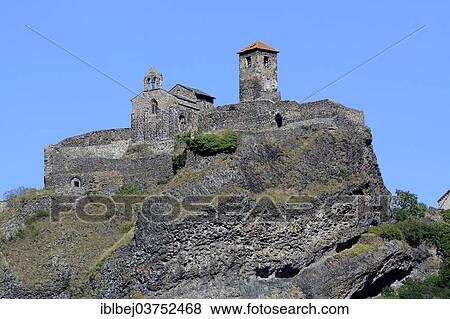 Stock Photo - "Saint Ilpize castle and the chapel, Saint Ilpize, Haute-Loire department, Auvergne, France, Europe". Fotosearch