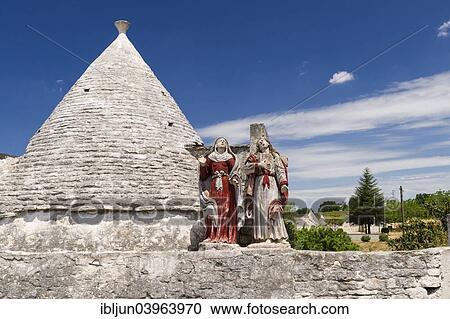"Saints, religious piety, Trullo, traditional round cone house, in Martina Franca, Valle d'Itria, Trulli Valley, Apulia, Italy, Europe" View Large Photo Image Stock Image - "Saints, religious piety, Trullo, traditional round cone house, in Martina Franca, Valle d'Itria, Trulli Valley, Apulia, Italy, Europe". Fotosearch