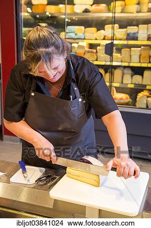 "Saleswoman at the cheese counter in the supermarket, Germany, Europe" View Large Photo Image Picture - "Saleswoman at the cheese counter in the supermarket, Germany, Europe". Fotosearch
