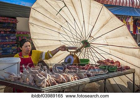 "Saleswoman on the market, meat stand with large parasol, Pang Mapha, Mae Hong Song province, Northern Thailand, Thailand, Asia" View Large Photo Image Stock Photography - "Saleswoman on the market, meat stand with large parasol, Pang Mapha, Mae Hong Song province, Northern Thailand, Thailand, Asia". Fotosearch
