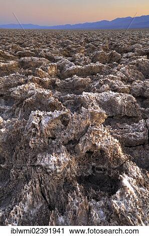 "Salt crusts at the Devil's Golf Course at sunset, Panamint Range, Death Valley National Park, Mojave Desert, California, USA" View Large Photo Image Stock Image - "Salt crusts at the Devil's Golf Course at sunset, Panamint Range, Death Valley National Park, Mojave Desert, California, USA". Fotosearch