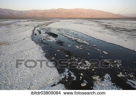 Picture - "Salt marshes in the morning, Panamint Range in the back, central Death Valley, Death Valley National Park, California, USA". Fotosearch
