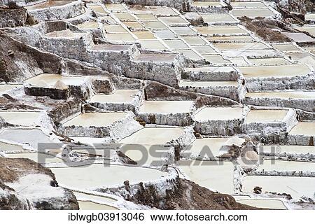 Stock Photograph - "Salt pans on a mountainside, Salinas de Maras salt pans, created by the Incas and still in operation, Pichingote, Cusco region, Andes, Peru, South America". Fotosearch