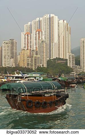 "Sampan boat in Aberdeen Harbour, Sampan boat harbour, skyscrapers at Aberdeen Channel at back, Aberdeen, Hong Kong, China, Asia" View Large Photo Image Stock Image - "Sampan boat in Aberdeen Harbour, Sampan boat harbour, skyscrapers at Aberdeen Channel at back, Aberdeen, Hong Kong, China, Asia". Fotosearch