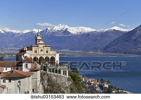 "Sanctuary of the Madonna del Sasso or Our Lady of the Rock looking over Lake Maggiore towards snow-capped mountains, Orselina, Locarno, Kanton Tessin, Switzerland, Europe" View Large Photo Image Stock Image - "Sanctuary of the Madonna del Sasso or Our Lady of the Rock looking over Lake Maggiore towards snow-capped mountains, Orselina, Locarno, Kanton Tessin, Switzerland, Europe". Fotosearch