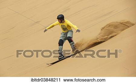 "Sand boarding in the dunes of the Namib Desert, near Swakopmund, Namibia, Africa" View Large Photo Image Stock Image - "Sand boarding in the dunes of the Namib Desert, near Swakopmund, Namibia, Africa". Fotosearch