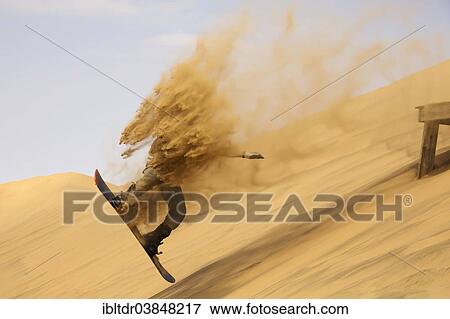 "Sand boarding in the dunes of the Namib Desert, near Swakopmund, Namibia, Africa" View Large Photo Image Stock Photo - "Sand boarding in the dunes of the Namib Desert, near Swakopmund, Namibia, Africa". Fotosearch