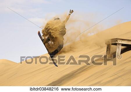 "Sand boarding in the dunes of the Namib Desert, near Swakopmund, Namibia, Africa" View Large Photo Image Stock Photograph - "Sand boarding in the dunes of the Namib Desert, near Swakopmund, Namibia, Africa". Fotosearch