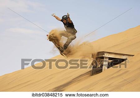 "Sand boarding in the dunes of the Namib Desert, near Swakopmund, Namibia, Africa" View Large Photo Image Stock Photography - "Sand boarding in the dunes of the Namib Desert, near Swakopmund, Namibia, Africa". Fotosearch