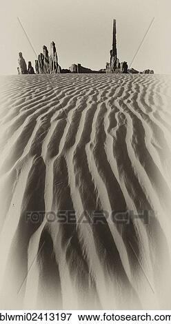 Stock Photo - Sand dune in front of Totem Pole and Yei Bi Chei rock formations, Monument Valley Navajo Tribal Park, Navajo Nation Reservation, Arizona, Southwest, Utah, United States of America, USA. Fotosearch
