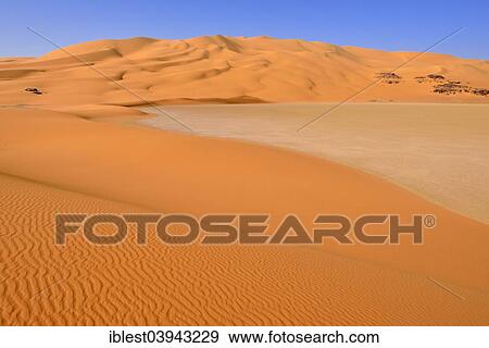 Stock Photo - "Sand dunes and playa, claypan, Tassili n'Ajjer National Park, Unesco World Heritage Site, Sahara desert, near Oued In Djerane, Algeria, Africa". Fotosearch