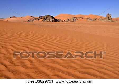 "Sand dunes and rocks at Tin Merzouga, Tadrart region, Tassili n'Ajjer National Park, Unesco World Heritage Site, Algeria, Sahara, Africa" View Large Photo Image Stock Image - "Sand dunes and rocks at Tin Merzouga, Tadrart region, Tassili n'Ajjer National Park, Unesco World Heritage Site, Algeria, Sahara, Africa". Fotosearch