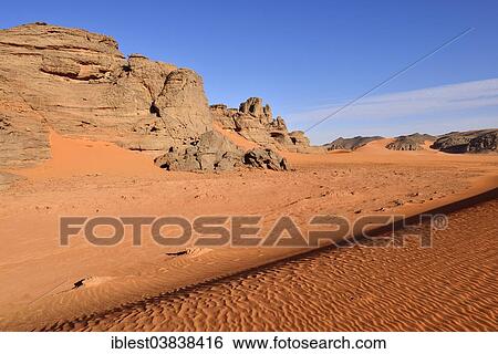 Stock Photograph - "Sand dunes and rocks at Tin Merzouga, Tadrart region, Tassili n'Ajjer National Park, Unesco World Heritage Site, Algeria, Sahara, North Africa, Africa". Fotosearch