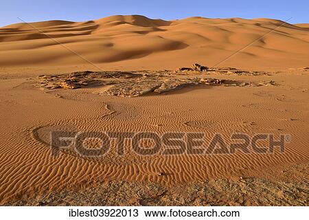 "Sand dunes and sandstone rocks at Oued In Djerane, Tadrart, Tassili n'Ajjer National Park, Unesco World Heritage Site, Sahara desert, Algeria, Africa" View Large Photo Image Stock Image - "Sand dunes and sandstone rocks at Oued In Djerane, Tadrart, Tassili n'Ajjer National Park, Unesco World Heritage Site, Sahara desert, Algeria, Africa". Fotosearch