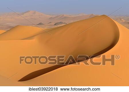 "Sand dunes of Oued In Djerane, Tadrart region, Tassili n'Ajjer National Park, Sahara desert, Algeria, Africa" View Large Photo Image Stock Photo - "Sand dunes of Oued In Djerane, Tadrart region, Tassili n'Ajjer National Park, Sahara desert, Algeria, Africa". Fotosearch