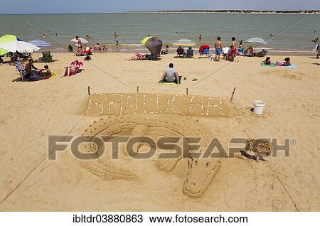 "Sand sculpture of a crocodile, at the beach of the Guadalquivir river mouth, Sanlucar de Barrameda, Cadiz province, Andalusia, Spain, Europe" View Large Photo Image Stock Image - "Sand sculpture of a crocodile, at the beach of the Guadalquivir river mouth, Sanlucar de Barrameda, Cadiz province, Andalusia, Spain, Europe". Fotosearch