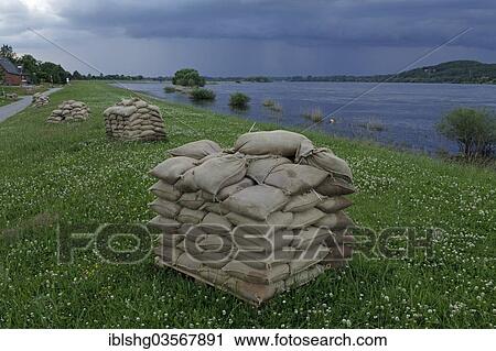 Stock Image - "Sandbags on a dyke during a flood, near Tespe, Lower Saxony, Germany, Europe". Fotosearch