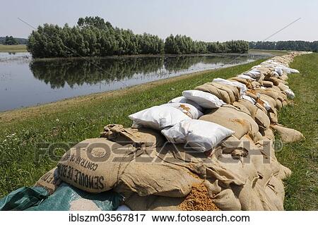 "Sandbags protecting a dike along the Elbe against floods, Lutherstadt Wittenberg, Saxony-Anhalt, Germany, Europe" View Large Photo Image Stock Photo - "Sandbags protecting a dike along the Elbe against floods, Lutherstadt Wittenberg, Saxony-Anhalt, Germany, Europe". Fotosearch