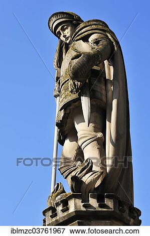 "Sandstone statue of St. Florian against a blue sky, Hassfurt, Lower Franconia, Bavaria, Germany, Europe" View Large Photo Image Stock Photo - "Sandstone statue of St. Florian against a blue sky, Hassfurt, Lower Franconia, Bavaria, Germany, Europe". Fotosearch