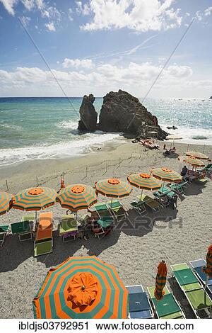 "Sandy beach and colorful sunshades, Monterosso al Mare, Cinque Terre, La Spezia Province, Liguria, Italy, Europe" View Large Photo Image Stock Image - "Sandy beach and colorful sunshades, Monterosso al Mare, Cinque Terre, La Spezia Province, Liguria, Italy, Europe". Fotosearch