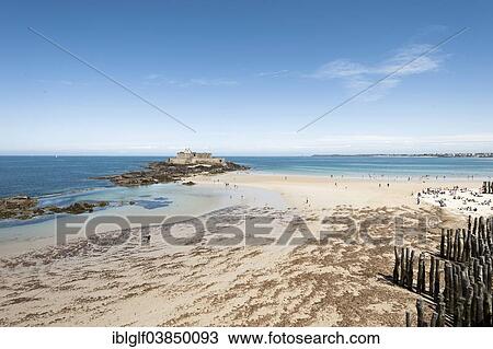 "Sandy beach with groynes and Fort National, St. Malo, Brittany, France, Europe" View Large Photo Image Stock Image - "Sandy beach with groynes and Fort National, St. Malo, Brittany, France, Europe". Fotosearch