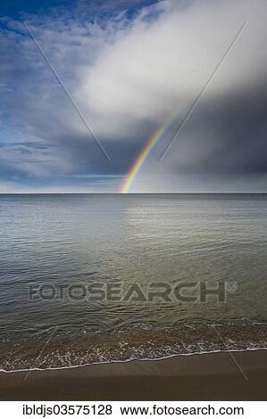 "Sandy beach with rainbow over the sea, L'Escala, Costa Brava, Catalonia, Spain, Europe" View Large Photo Image Stock Photo - "Sandy beach with rainbow over the sea, L'Escala, Costa Brava, Catalonia, Spain, Europe". Fotosearch