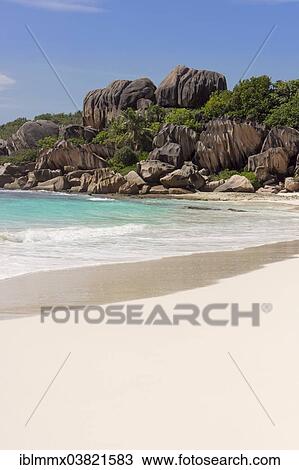 Stock Image - "Sandy beach with the rock formations typical for the Seychelles, Grand Anse, La Digue, Seychelles, Africa". Fotosearch
