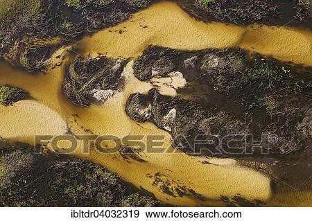 Stock Photo - "Sandy section of the Gomoti River with its channels and islands, aerial view, Okavango Delta, Moremi Game Reserve, Botswana, Africa". Fotosearch
