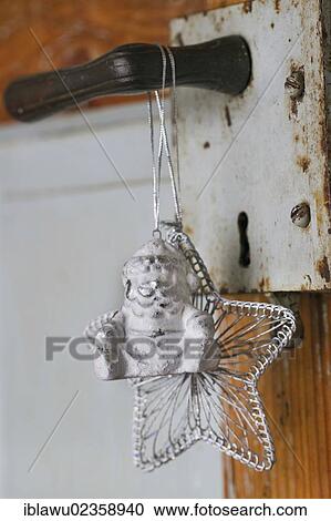 "Santa Claus, Christmas star, Christmas decorations on an old doorknob" View Large Photo Image Stock Image - "Santa Claus, Christmas star, Christmas decorations on an old doorknob". Fotosearch