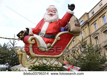 Picture - "Santa Claus figure on a sled, Baden-Wurttemberg, Germany, Europe". Fotosearch