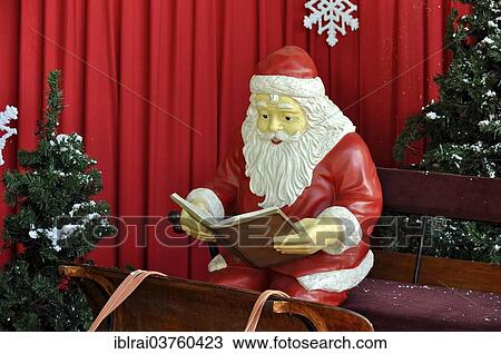 "Santa Claus figure sitting on a sled reading, Baden-Wurttemberg, Germany, Europe" View Large Photo Image Stock Image - "Santa Claus figure sitting on a sled reading, Baden-Wurttemberg, Germany, Europe". Fotosearch
