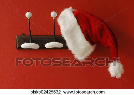 Santa Claus hat hanging on nostalgic coat hooks View Large Photo Image Stock Image - Santa Claus hat hanging on nostalgic coat hooks. Fotosearch