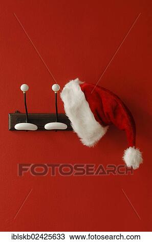 Santa Claus hat hanging on nostalgic coat hooks View Large Photo Image Stock Image - Santa Claus hat hanging on nostalgic coat hooks. Fotosearch