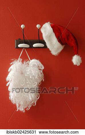 Santa hat and beard hanging on nostalgic coat hooks View Large Photo Image Stock Image - Santa hat and beard hanging on nostalgic coat hooks. Fotosearch