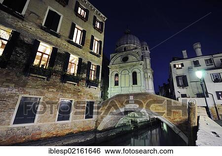 Stock Photograph - "Santa Maria dei Miracoli at night, with a bridge crossing a canal, Cannaregio, Venice, Venezia, Veneto, Italy, Europe". Fotosearch