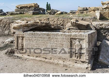 Stock Photo - "Sarcophagus with reliefs and inscriptions, necropolis in Hierapolis, ancient Greek city in Pamukkale, Phrygia, Denizli Province, Turkey, Asia". Fotosearch