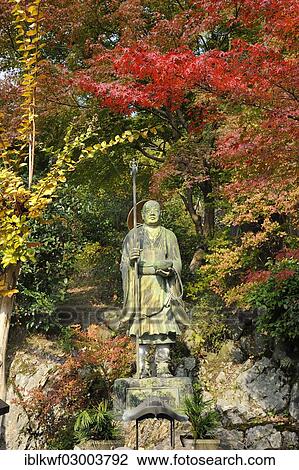 "Sat May Ing Temple with a Buddha statue, maple and gingko trees with red and yellow autumnal foliage at back, Iwakura, Kyoto, Kinki region, Japan, Asia" View Large Photo Image Stock Image - "Sat May Ing Temple with a Buddha statue, maple and gingko trees with red and yellow autumnal foliage at back, Iwakura, Kyoto, Kinki region, Japan, Asia". Fotosearch