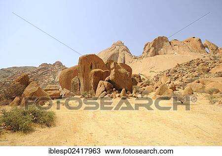 Savannah landscape with granite rocks and Spitzkoppe Mountain, Grosse Spitzkuppe Nature Reserve, Namibia, Africa View Large Photo Image Stock Image - Savannah landscape with granite rocks and Spitzkoppe Mountain, Grosse Spitzkuppe Nature Reserve, Namibia, Africa. Fotosearch