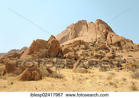 Savannah landscape with granite rocks and Spitzkoppe Mountain, Grosse Spitzkuppe Nature Reserve, Namibia, Africa View Large Photo Image Stock Photo - Savannah landscape with granite rocks and Spitzkoppe Mountain, Grosse Spitzkuppe Nature Reserve, Namibia, Africa. Fotosearch