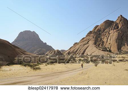 Stock Photo - Savannah landscape with granite rocks and Spitzkoppe Mountain, Pontok Mountains, Grosse Spitzkuppe Nature Reserve, Namibia, Africa. Fotosearch