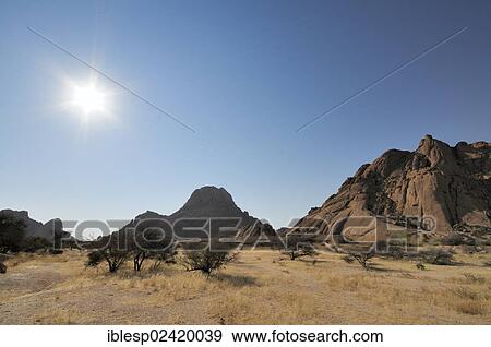 Savannah landscape with granite rocks and Spitzkoppe Mountain, Spitzkoppe, Grosse Spitzkuppe Nature Reserve, Namibia, Africa View Large Photo Image Stock Photo - Savannah landscape with granite rocks and Spitzkoppe Mountain, Spitzkoppe, Grosse Spitzkuppe Nature Reserve, Namibia, Africa. Fotosearch