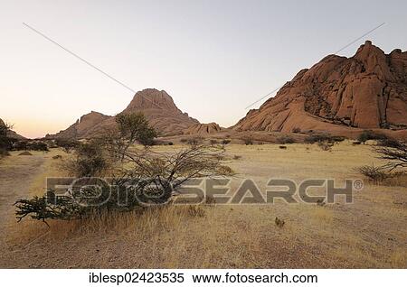 Savannah landscape with rock formations, Great Spitzkoppe and Pontok Mountains, Great Spitzkoppe Nature Reserve, Namibia, Africa View Large Photo Image Stock Photography - Savannah landscape with rock formations, Great Spitzkoppe and Pontok Mountains, Great Spitzkoppe Nature Reserve, Namibia, Africa. Fotosearch