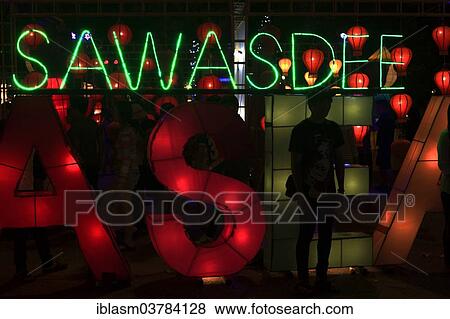 "Sawasdee"""" lettering in neon lights, """"welcome"""" to the Loi Krathong festival of lights, Thapae Gate, Chiang Mai, Thailand, Asia" View Large Photo Image Stock Photo - "Sawasdee"""" lettering in neon lights, """"welcome"""" to the Loi Krathong festival of lights, Thapae Gate, Chiang Mai, Thailand, Asia". Fotosearch