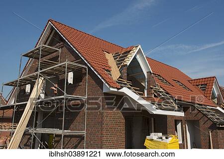 "Scaffolded newly built house, roofing, Aurich, Lower Saxony, Germany, Europe" View Large Photo Image Stock Image - "Scaffolded newly built house, roofing, Aurich, Lower Saxony, Germany, Europe". Fotosearch