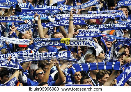 "Schalke fans on the north stand holding up scarves, FC Schalke 04 - Borussia Dortmund, Veltins Arena, Gelsenkirchen, North Rhine-Westphalia, Germany, Europe" View Large Photo Image Stock Image - "Schalke fans on the north stand holding up scarves, FC Schalke 04 - Borussia Dortmund, Veltins Arena, Gelsenkirchen, North Rhine-Westphalia, Germany, Europe". Fotosearch