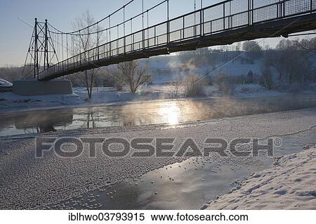 "Schaukelbrucke footbridge over the Saale, Grosseutersdorf, Thuringia, Germany, Europe" View Large Photo Image Stock Photography - "Schaukelbrucke footbridge over the Saale, Grosseutersdorf, Thuringia, Germany, Europe". Fotosearch